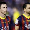photo xavi et messi avec le regard des mauvais soirs...