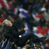 photo didier deschamps porté en héros après la victoire en barrages face à l'ukraine.