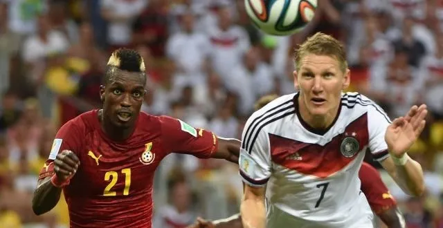 photo john boye et bastian schweinsteiger. &copy; photo : afp