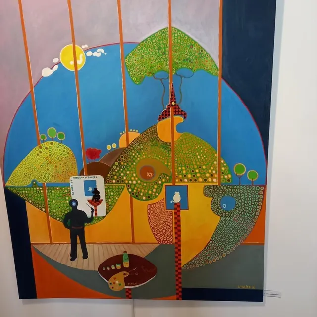 photo « le chat de monsieur vermeer ». en noir, rené regarde vermeer qui peint son chat. une mise en abyme, un clin d’œil au visiteur, comme il aime faire quelquefois. et toujours saint-léonard, reconnaissable à son clocher qui dépasse des arbres.  ©  ouest-france