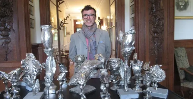 photo  denis monfleur devant quelques-unes de ses sculptures.  &copy;  ouest-france 