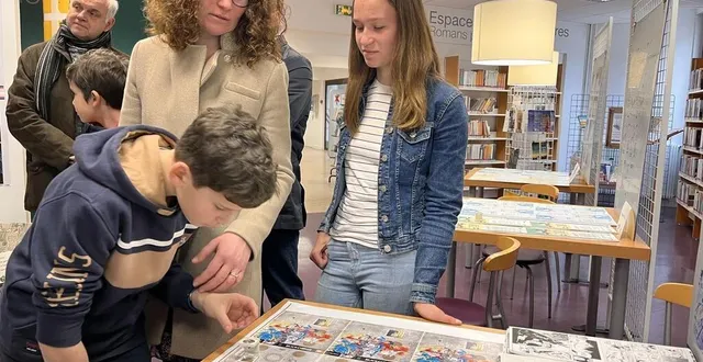 photo  les visiteurs de l’exposition présentée par l’imprimerie brodard et taupin, à la bibliothèque, peuvent utiliser un compte-fils, sorte de loupe qui permet de voir les points de trame sur les plaques d’une des quatre couleurs pour l’impression offset.  &copy;  ouest-france 