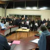 photo  les membres du collectif non à l’entrepôt entourent les élus du conseil municipal, mardi 14 mars 2023, à trangé (sarthe). 