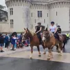 photo  un défilé de chevaux de traits et leurs cavaliers dans le bourg a entraîné le public vers le champ de courses et ses animations. 