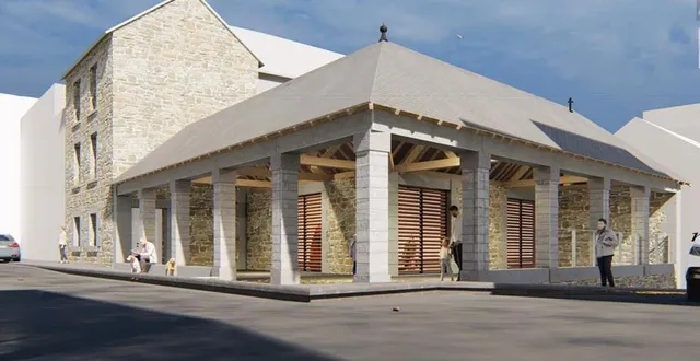 photo  à gauche, l’ancienne maison de la presse transformée en habitation, dont l’entrée est située sous la nouvelle halle.  &copy;  boo’architecture & alidade 