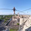 photo  la funambule tatiana-mosio bongonga, de la compagnie basinga, traversera la promenade newton, au mans (sarthe), le 22 juin 2024, en ouverture du festival circassien. 