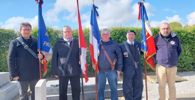 photo  porte-drapeaux et membres d’associations de combattants devant la tombe du soldat américain davidson, à couterne. de gauche à droite : cédric moulin, chantal miclard, martial serais, claude lefèvre et didier miclard  &copy;  ouest-france 