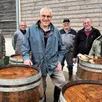 photo  guy maugeais, le président de l’association organisatrice de la fête du cidre à solesmes, entouré par une partie de ses acolytes lors du lavage des barriques. 