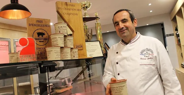 photo  laurent berthier avec une partie de ses nombreux trophées et ses fameux pots de rillettes, dans son magasin, à chantenay-villedieu (sarthe).  &copy;  ouest-france 