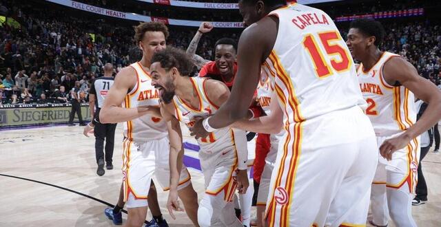 photo  trae young a rentré un tir invraisemblable du milieu de terrain au buzzer pour permettre à atlanta de battre utah.  ©  photo : melissa majchrzak/getty images via afp 