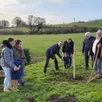 photo  le maire et ses adjoints ont planté quatre arbres, trois amandiers et un pommier. 