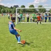photo un jeune footballeur du sablé fc au tournoi du 8 mai, en 2024.