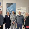 photo  françois montambault, président du conseil d’administration, valérie alain, conseillère départementale, joseph vivier, délégué départemental de l’association du souvenir français, jean ripaux, porte-drapeaux, et christine roimier, devant l’affiche de l’exposition, le 7 mai 2025. 