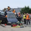 photo  beaufort, le 24 mai 2025. sous les yeux des visiteurs impressionnés, les sapeurs-pompiers ont réalisé une manœuvre spectaculaire de désincarcération après un accident de la circulation. 