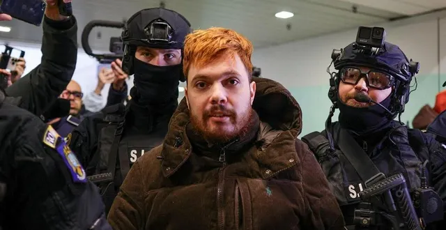 photo  mohamed amra, lors de son arrestation en roumanie fin février 2025.  &copy;  afp 