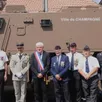 photo le maire patrick desmazières, accompagné de représentants de l’armée, devant le véhicule blindé de type griffon nommé « ville de champagné ».