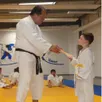 photo le passage de ceinture avec remise de diplôme, un moment attendu par les jeunes judokas.