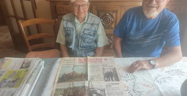 photo  yves et alain robert devant une page de une du courrier de l’ouestayant largement relaté la fête des moissons.  &copy;  co 