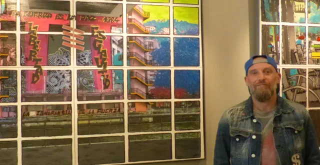 photo  l’artiste vincils devant ses œuvres exposées à l’office de tourisme.  &copy;  ouest-france 