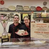 photo  gérald et émilie goupille exposent fièrement le trophée et le diplôme qu’ils ont obtenu pour leur meilleur boudin blanc. 