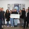 photo  mardi 25 novembre 2025, en présence de mattéo, au centre, et de sa famille, le président éric lemonnier, à gauche, a remis le chèque de 500 € au président de soleil afelt, vincent charbonnier, à droite. 