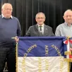 photo  le nouveau drapeau avec de gauche à droite : eric mroczkowski, yves longobardi et philippe richard. 