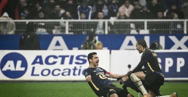 photo  benjamin andré et ethan mbappé après le but du capitaine lillois.  &copy;  arnaud finistre / afp 