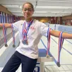 photo  eva fogang pose avec ses sept médailles autour du cou, remportées lors des championnats de france benjamin(e)s à dunkerque. 