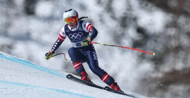 photo  breezy johnson lors de la descente des jeux olympiques de milan-cortina, le 8 février 2026.  &copy;  julian finney / getty images via afp 
