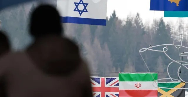 photo  les drapeaux israéliens et iraniens à milan cortina dans le cadre des jeux paralympiques 2026.  &copy;  the yomiuri shimbun via afp / daisuke urakami 