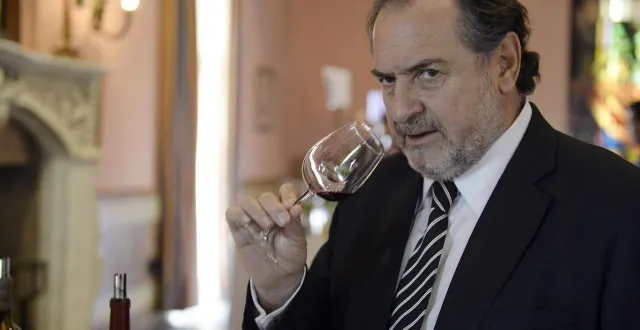 photo  french famous oenologist michel rolland smells a glass of wine, at the beausejour becot estate on april 2, 2014 in saint-emilion, during the 