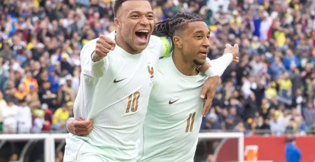 photo  kylian mbappé et michael olise pendant le match contre le brésil, jeudi.  &copy;  william volcov / brazil photo press via afp 