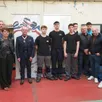 photo la direction du lycée, les professeurs, le jury et au centre, marc doise et les trois candidats luka delaplanche, théo broussard et antoine richard.