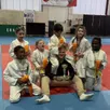 photo  les poussines du judo-club de thouarcé, championnes départementales, en compagnie de leur éducateur nicolas sadouet. 